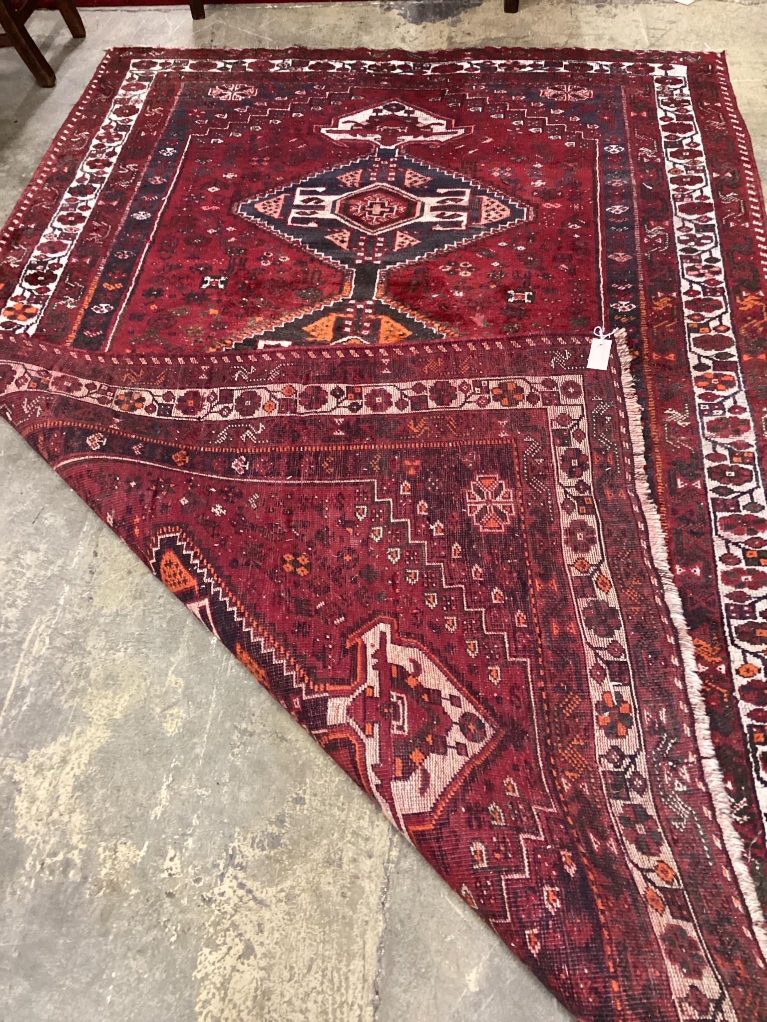 A Caucasian style red ground carpet, 270 x 168cm